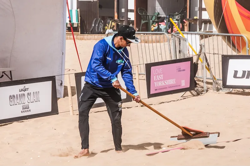 Coach Jack volunteering at a UKBT beach volleyball event